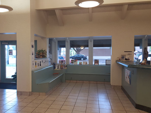 Reception area with seating and windows