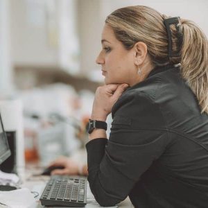 Staff member working on a computer