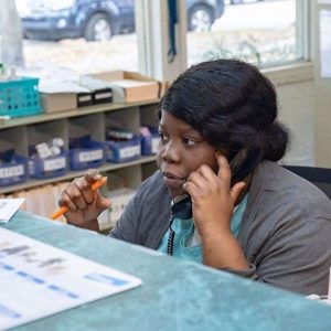 Receptionist on phone at front desk