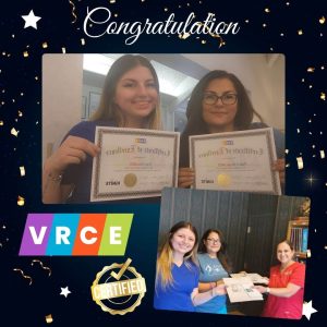 Team celebrating with certificates and awards